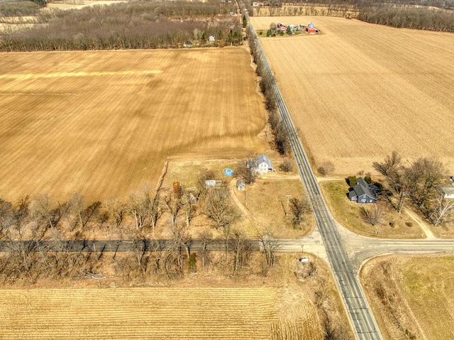 birds eye view of property with a rural view