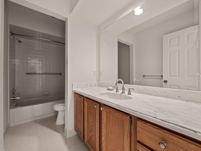 bathroom featuring toilet, shower / washtub combination, vanity, and tile patterned flooring