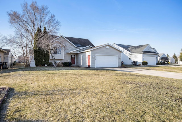 view of front of home with driveway, a front lawn, and a garage