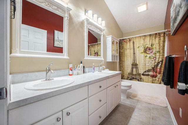 full bath featuring tile patterned flooring, double vanity, toilet, and a sink