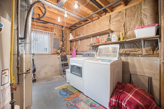 washroom featuring laundry area, electric panel, and washer and clothes dryer