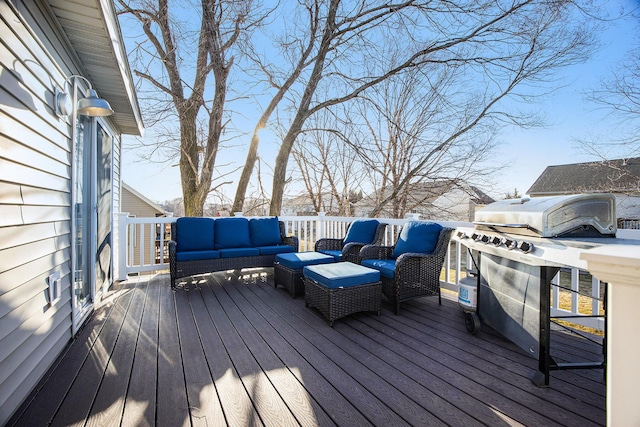 wooden terrace with an outdoor hangout area