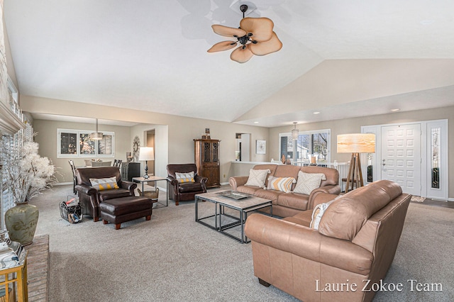 living room featuring carpet, ceiling fan, and high vaulted ceiling