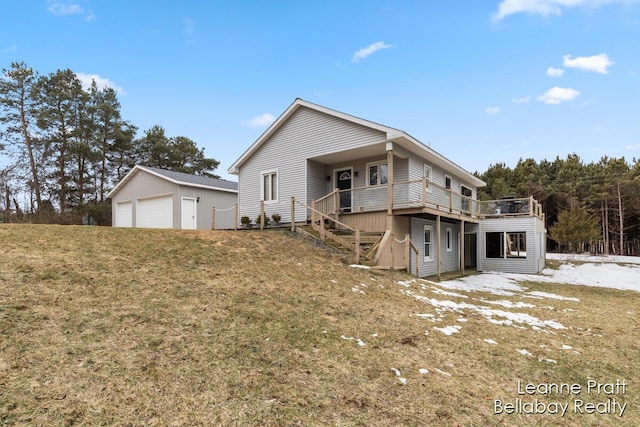 view of front of house featuring a garage, a wooden deck, an outdoor structure, and stairway