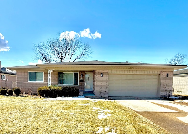 single story home with concrete driveway, a garage, brick siding, and a front lawn