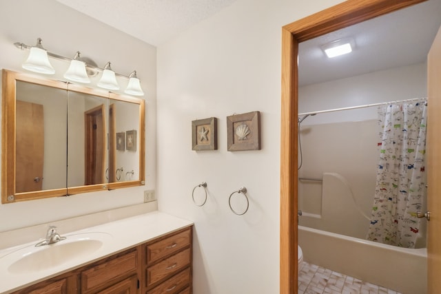 full bath with toilet, vanity, and shower / tub combo