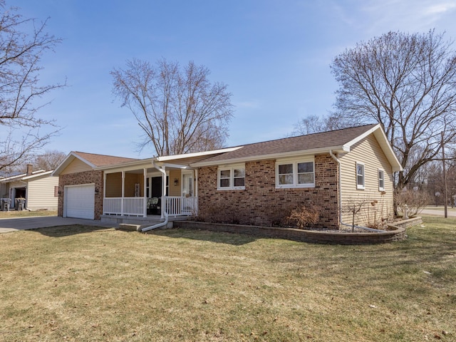 single story home with a porch, concrete driveway, a front yard, a garage, and brick siding