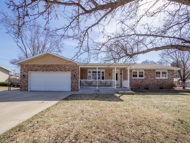 single story home with brick siding, a porch, concrete driveway, a front yard, and a garage