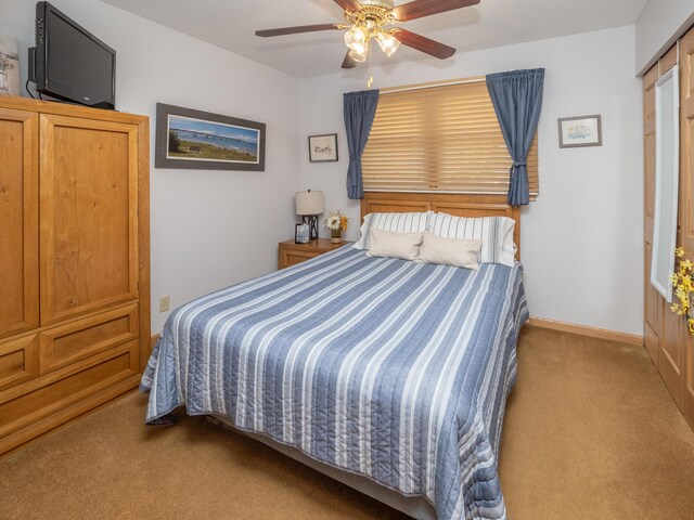 bedroom featuring carpet flooring, baseboards, and ceiling fan