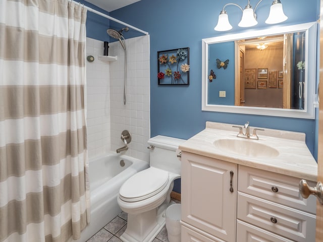 full bath featuring tile patterned floors, toilet, vanity, and shower / bath combo