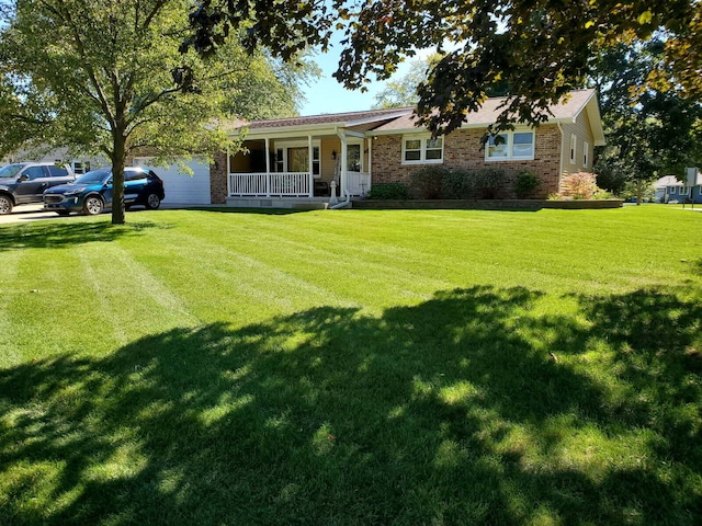 single story home with a porch, brick siding, and a front lawn