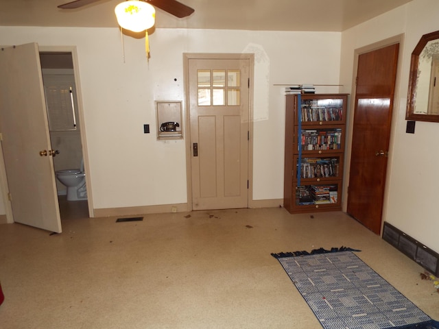 entryway featuring visible vents, baseboards, and ceiling fan