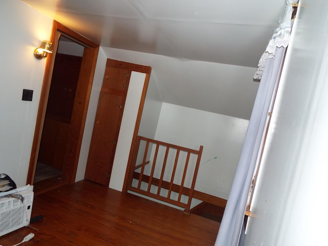 interior space featuring vaulted ceiling and wood finished floors