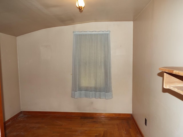 empty room with wood finished floors and baseboards