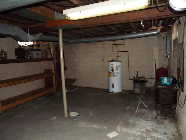 unfinished basement featuring water heater