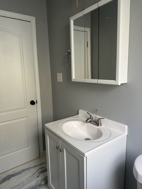 18635 Dale St, Detroit, MI 48219 - half bathroom with marble finish floor and vanity