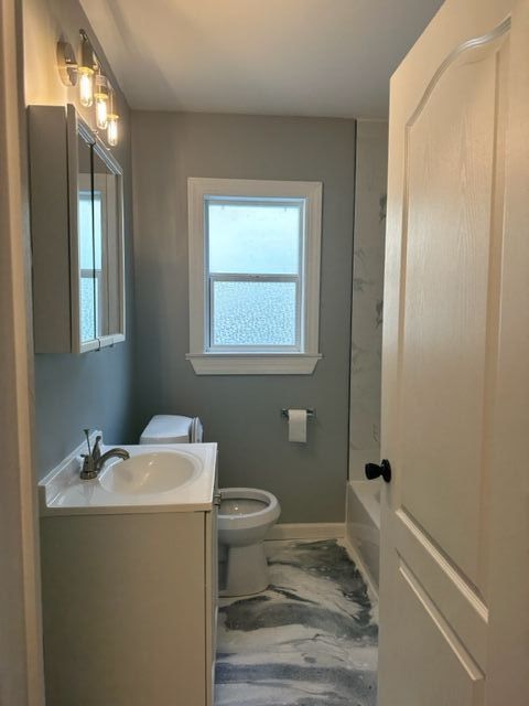 18635 Dale St, Detroit, MI 48219 - full bath featuring marble finish floor, baseboards, toilet, and vanity