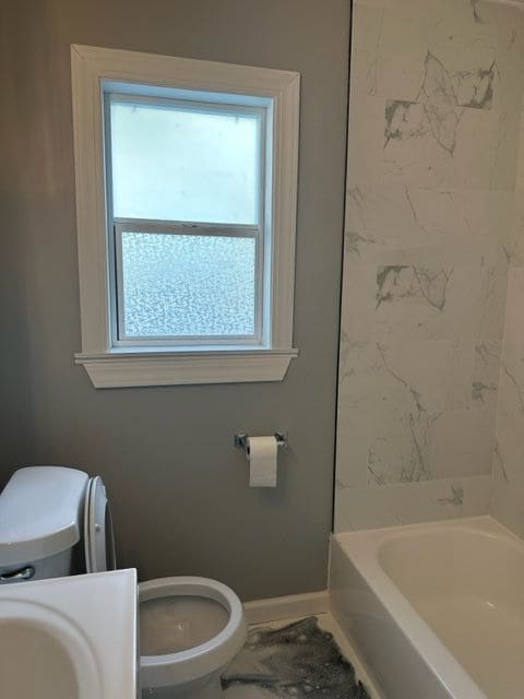 18635 Dale St, Detroit, MI 48219 - bathroom featuring baseboards, toilet, and vanity