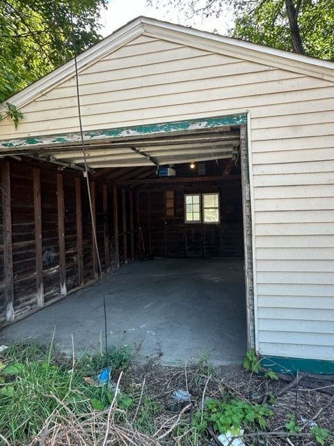 18635 Dale St, Detroit, MI 48219 - garage featuring a garage door opener