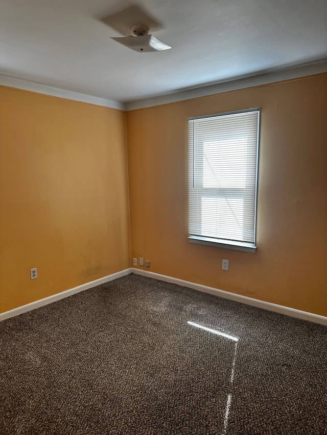 unfurnished room featuring baseboards