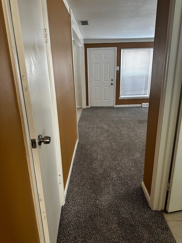 corridor with visible vents and baseboards