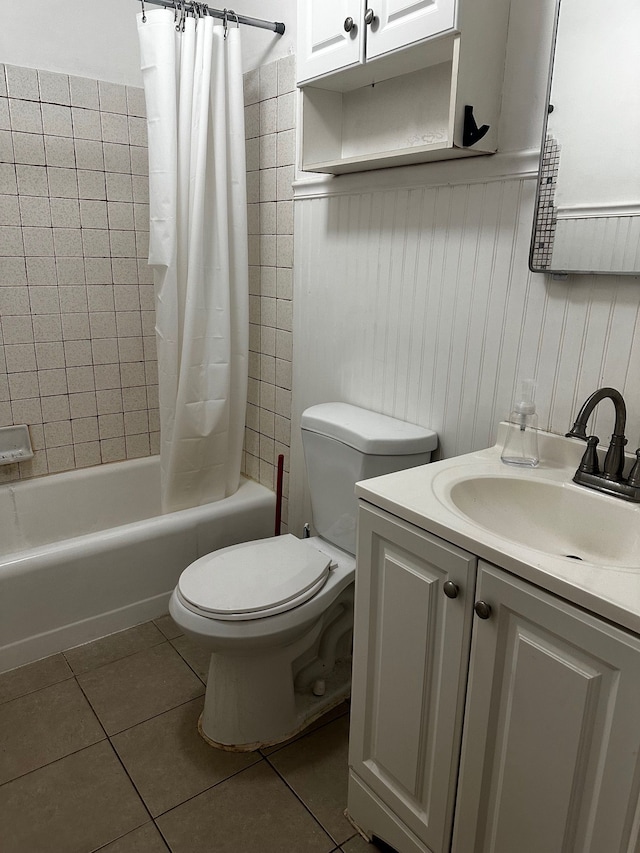 bathroom with tile patterned floors, vanity, toilet, and shower / tub combo with curtain