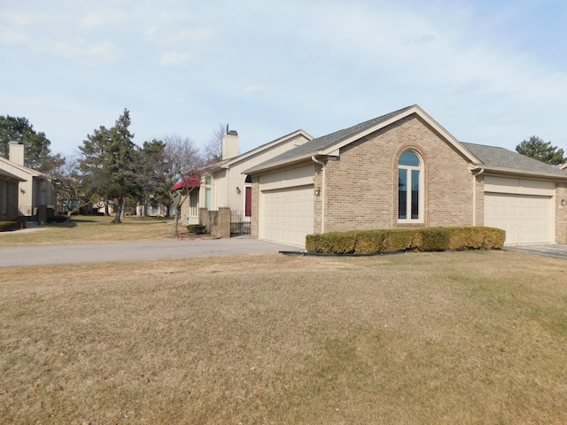 view of front of property featuring a front lawn, a garage, brick siding, and driveway