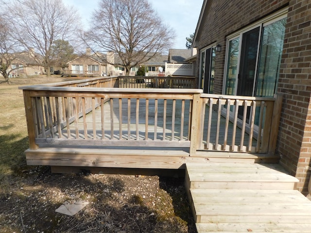 wooden terrace with a residential view