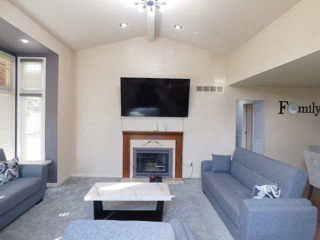 carpeted living room with a glass covered fireplace, visible vents, lofted ceiling with beams, and baseboards