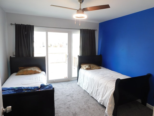 bedroom with carpet floors, ceiling fan, and access to exterior