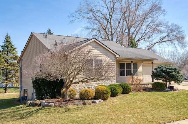 view of home's exterior with a lawn and roof with shingles