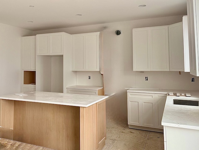 kitchen featuring white cabinetry and light countertops