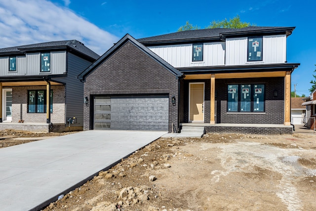 modern farmhouse style home with a porch, an attached garage, brick siding, and driveway