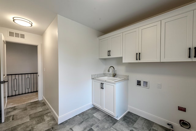 4107 Devon, Royal Oak, MI 48073 - laundry room featuring baseboards, hookup for a washing machine, and cabinet space