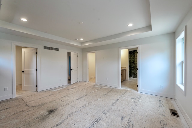 4107 Devon, Royal Oak, MI 48073 - unfurnished bedroom featuring a tray ceiling, recessed lighting, baseboards, and ensuite bath