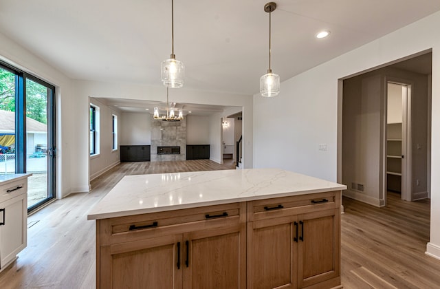 4107 Devon, Royal Oak, MI 48073 - kitchen featuring baseboards, a premium fireplace, light wood-type flooring, recessed lighting, and decorative light fixtures