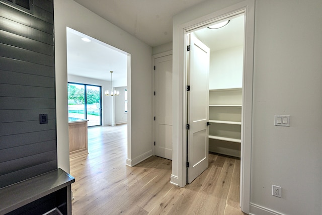 4107 Devon, Royal Oak, MI 48073 - hall featuring light wood finished floors, a chandelier, and baseboards