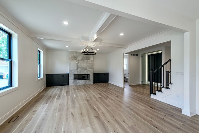4107 Devon, Royal Oak, MI 48073 - unfurnished living room featuring ornamental molding, healthy amount of natural light, light wood-style floors, baseboards, and beamed ceiling