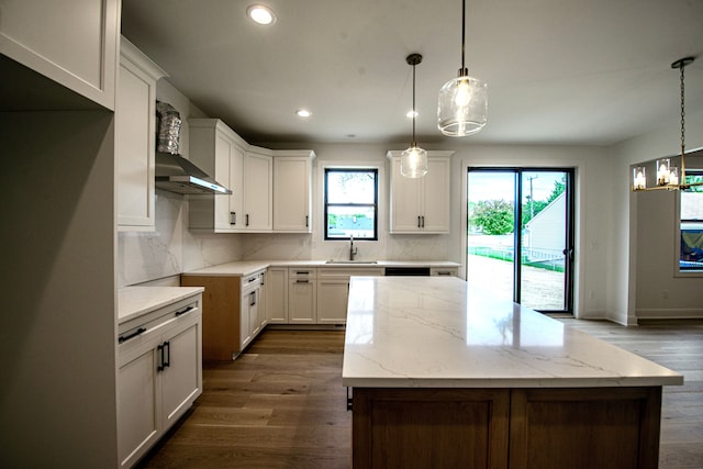 4107 Devon, Royal Oak, MI 48073 - kitchen featuring a kitchen island, tasteful backsplash, recessed lighting, dark wood finished floors, and light stone countertops