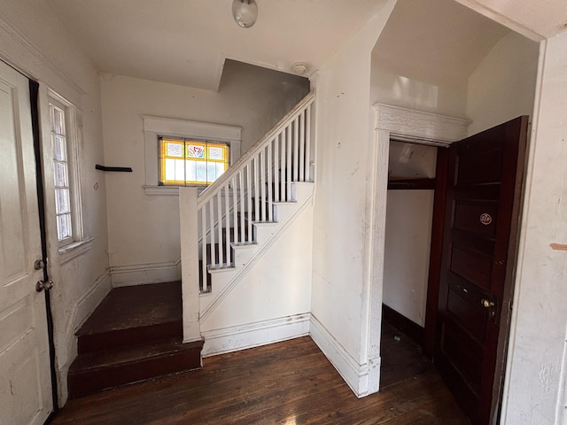 stairway with baseboards and wood-type flooring