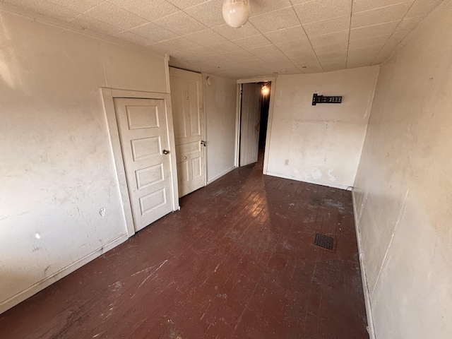 spare room featuring wood finished floors