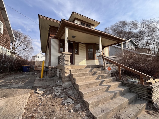 view of front of house with covered porch and driveway