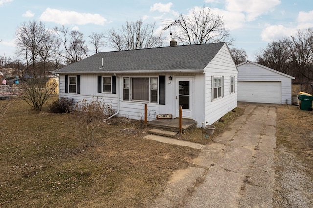 single story home with a chimney, a garage, a shingled roof, and an outdoor structure