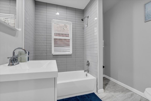 bathroom with marble finish floor, radiator, vanity, baseboards, and shower / bathtub combination