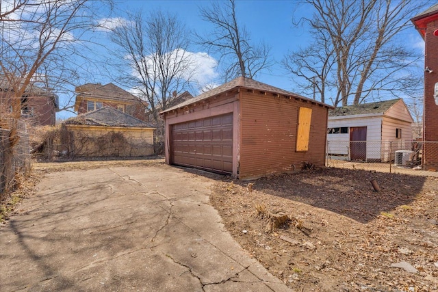 detached garage with cooling unit and fence