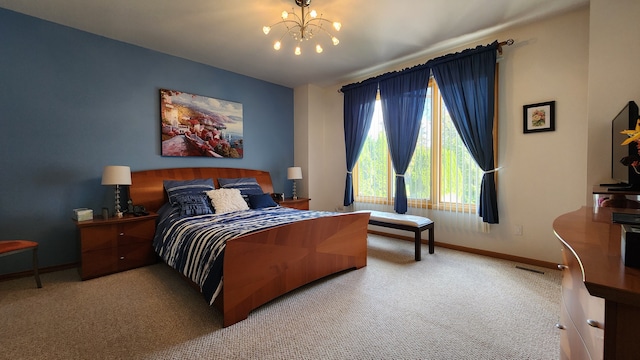 bedroom with visible vents, baseboards, carpet, and a chandelier