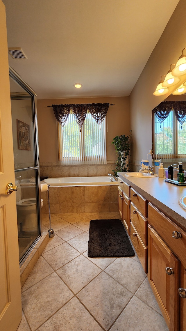 full bath featuring tile patterned flooring, visible vents, a stall shower, a bath, and vanity