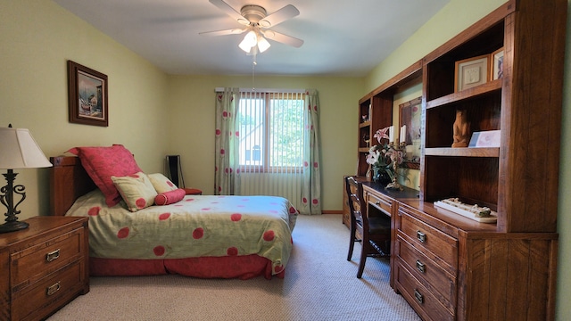 bedroom with light carpet and ceiling fan