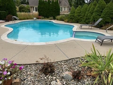 view of pool with a fenced in pool and a patio area