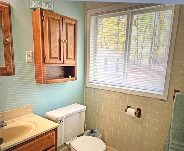 bathroom featuring toilet and vanity